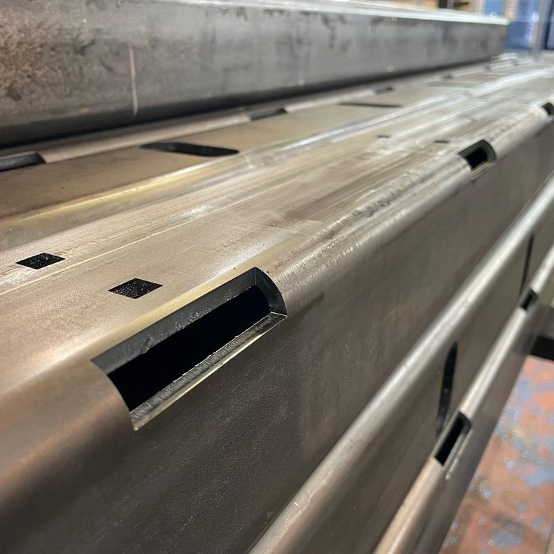 thick walled carbon steel tube with laser cut bolt holes