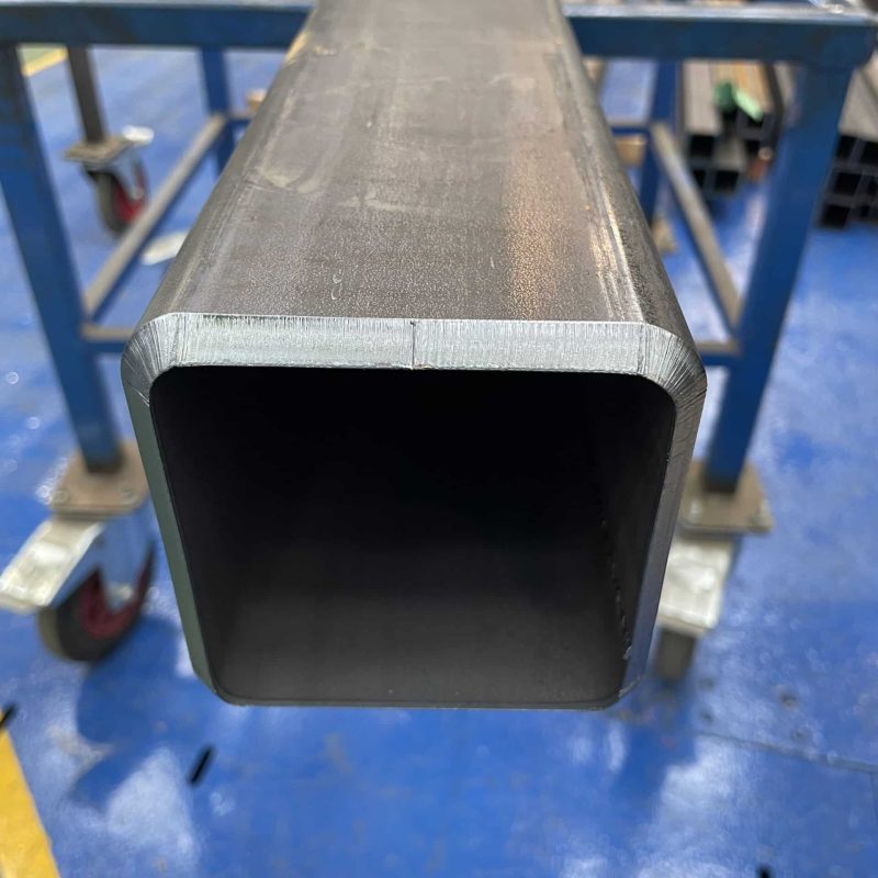 ectangular steel tube being laser cut at a 45 degree angle