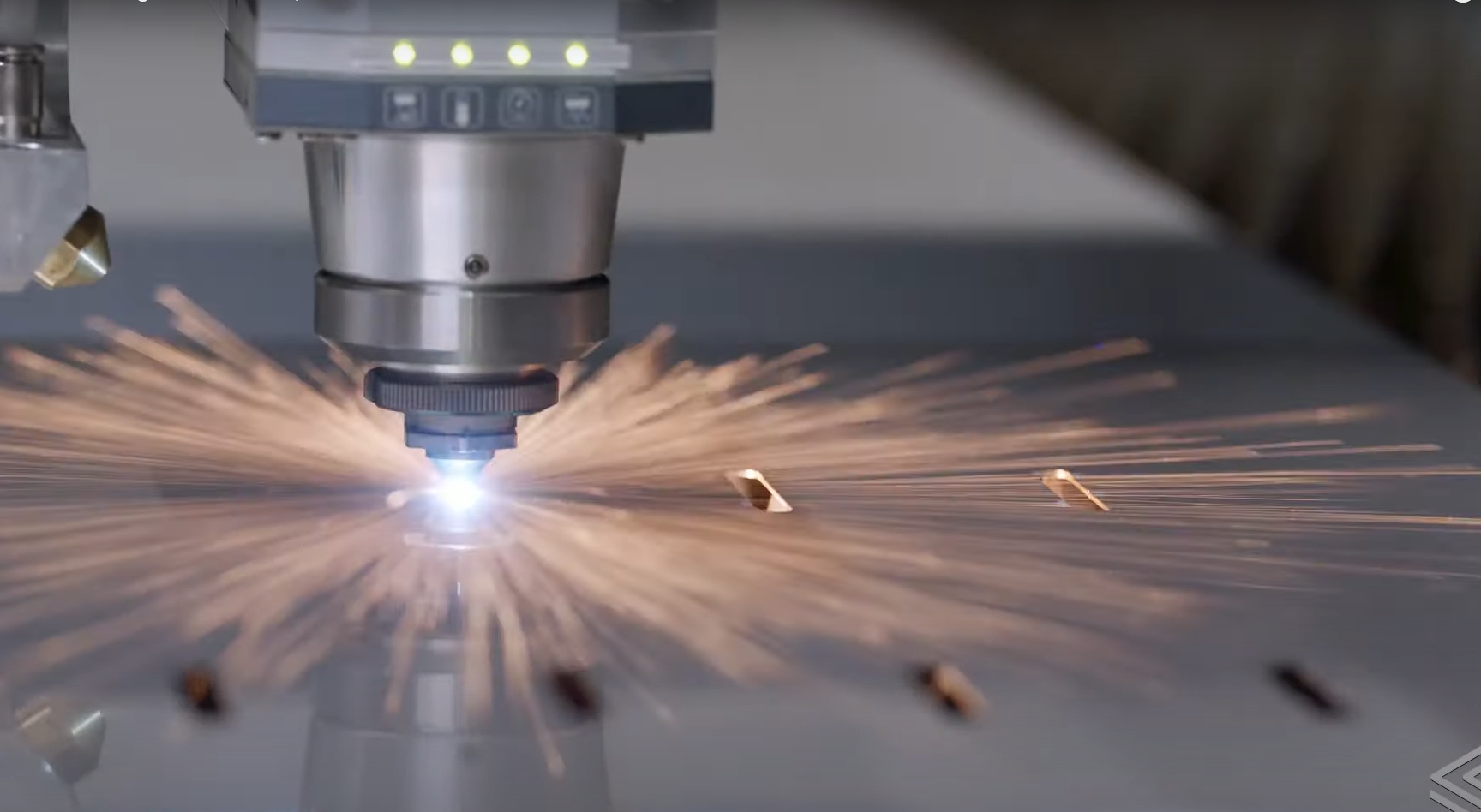 laser cutting machine in operation on stainless steel sheet