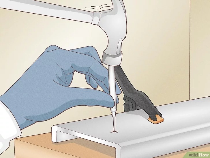 make a dent on your mark with a center punch