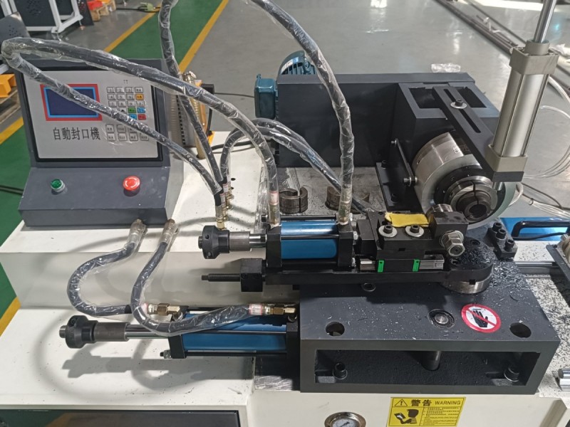 close up of control interface on tube end closing machine