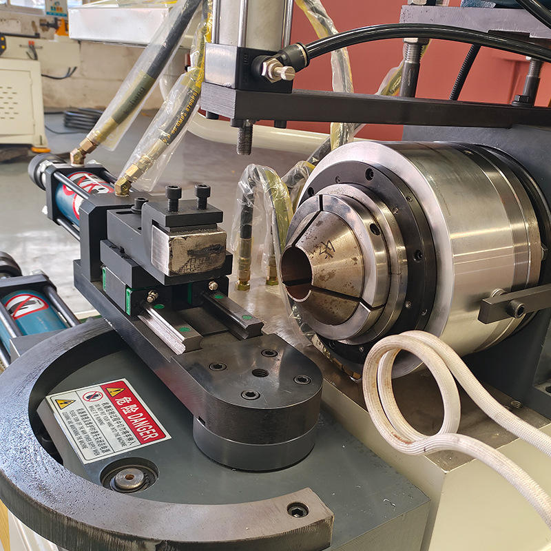 detail view of rf induction coil on tube end closing machine with rf heating system
