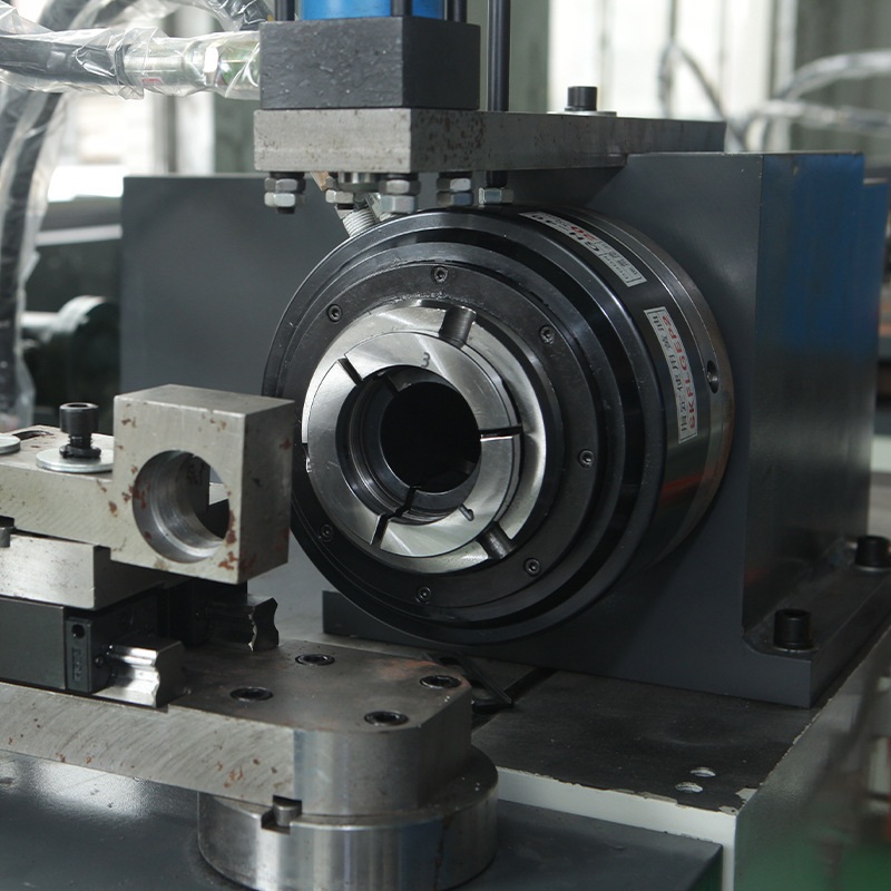 tube end closing machine with rf heating system spindle and rotating die close up