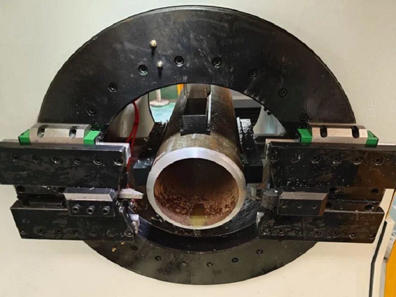 pam series cnc pipe cutting beveling machine clamping a steel pipe with precision jaws
