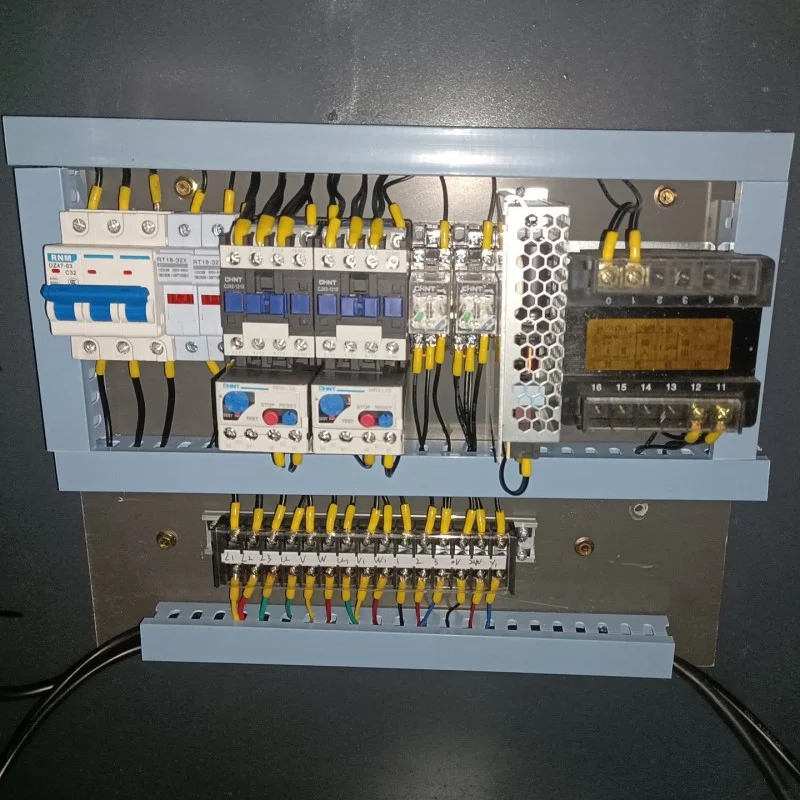 internal view of double head chamfering machine electrical control box including circuit breakers contactors terminal blocks and other components