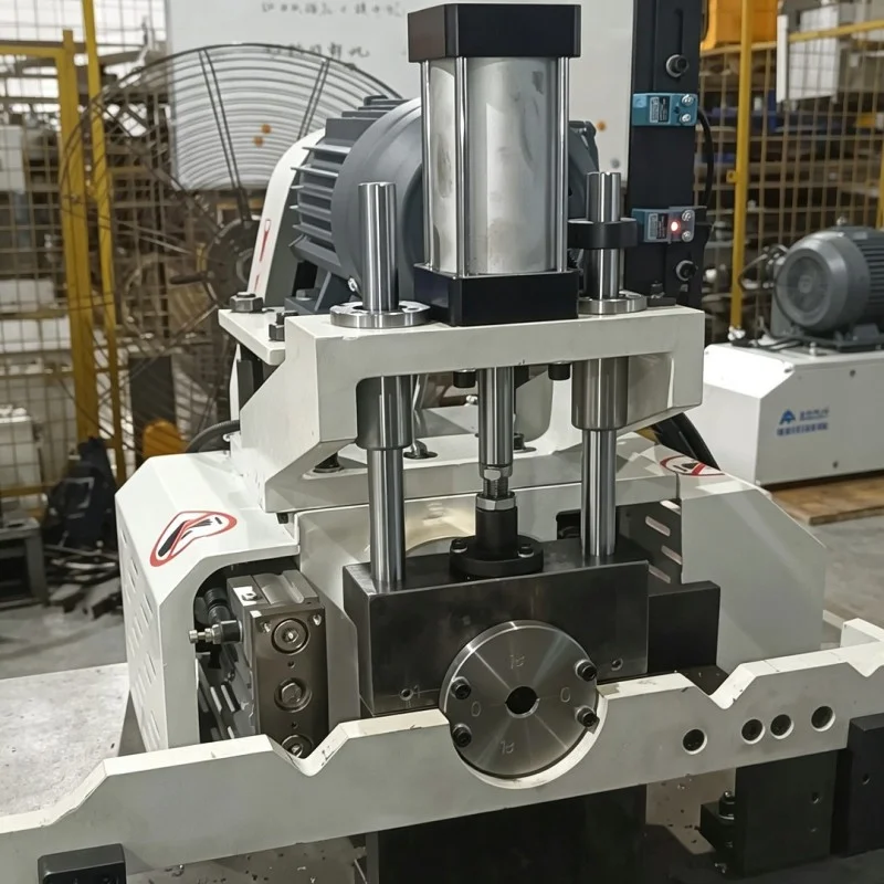 servo feed head of double head cnc chamfering machine showing cylinder drive and tool mounting structure