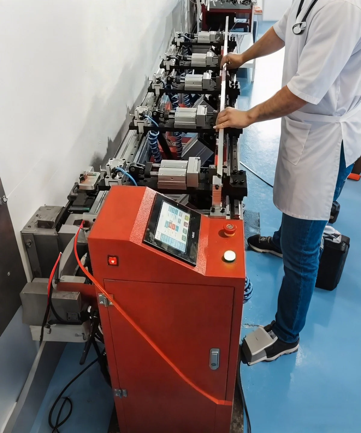 worker operating cnc profile punching machine