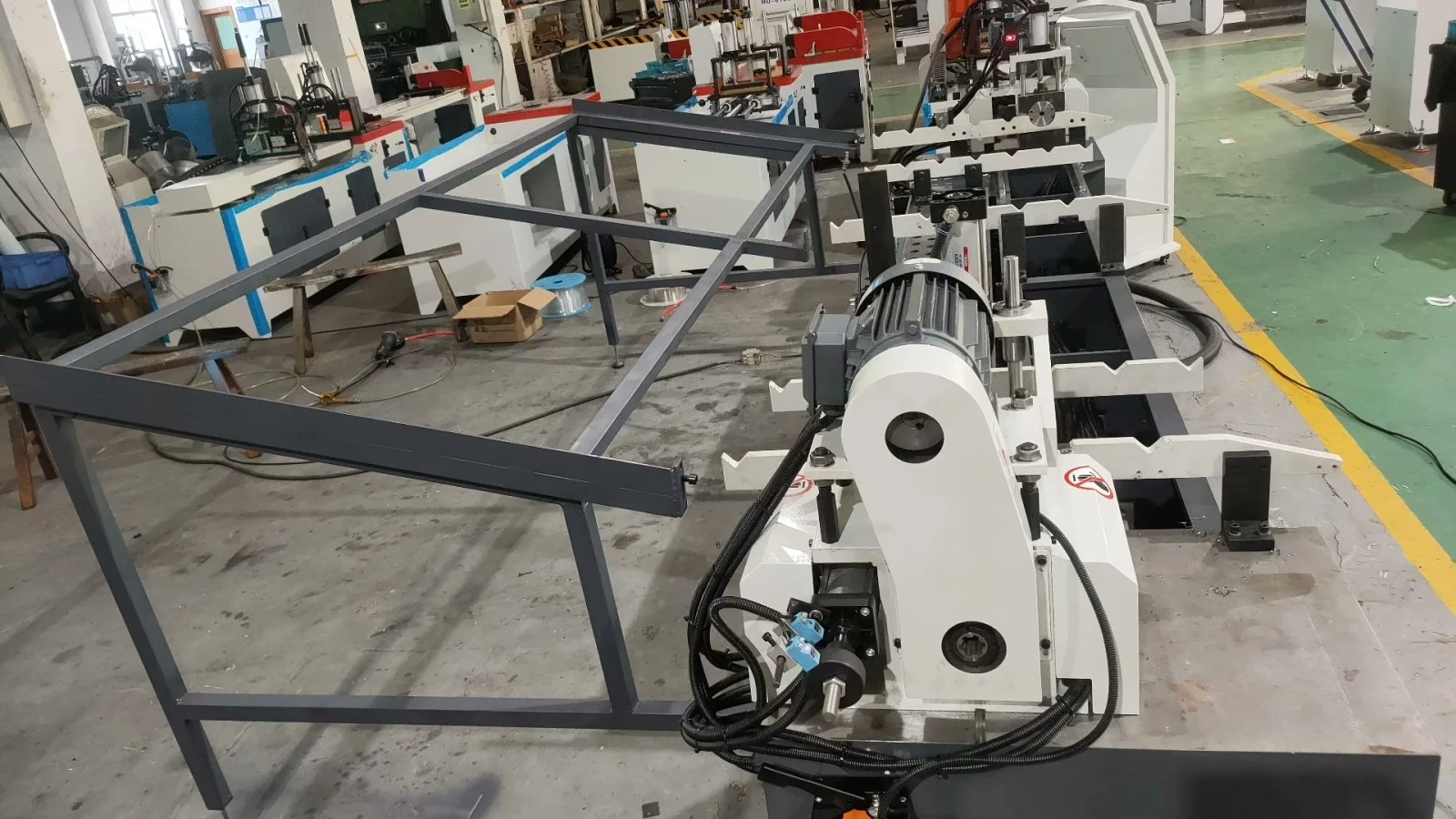workshop layout of double head cnc chamfering machine showing dual heads and long workpiece conveying bracket
